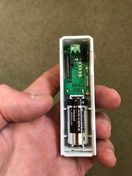 open door contacts to insert CR123A batteries